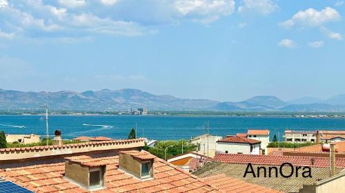 a view of the ocean from the roofs of buildings at AnnOra in SantʼAntìoco
