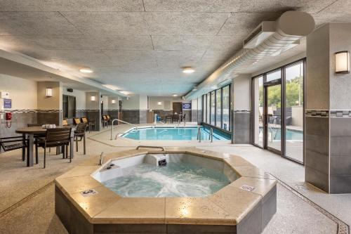 a large pool with a hot tub in a building at Drury Inn & Suites Springfield MO in Springfield