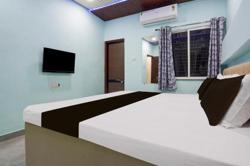 Ένα ή περισσότερα κρεβάτια σε δωμάτιο στο Hotel O JANNAT