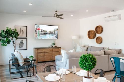 a living room with a couch and a table at 19-20| 2 Homes in St. George Green Valley with Community Pool in St. George