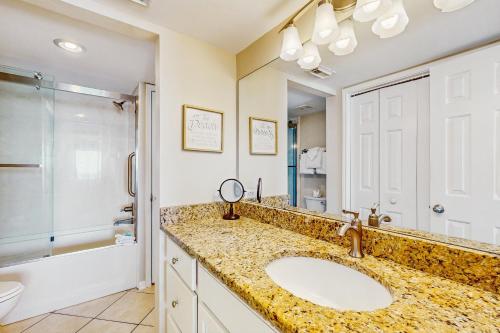 a bathroom with a sink and a shower and a toilet at Ocean House II 2602 in Gulf Shores