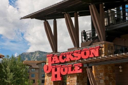 a sign for a restaurant on top of a building at The Way Home at Tensleep North in Teton Village