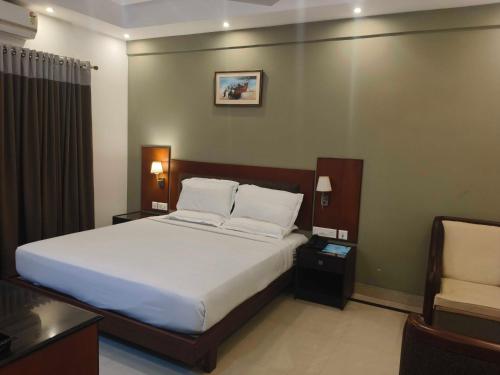 Ένα ή περισσότερα κρεβάτια σε δωμάτιο στο Hotel O Thumba Beach Trivandrum