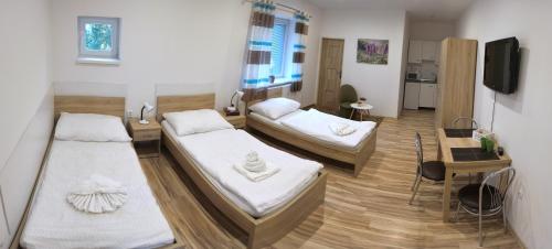 Postel nebo postele na pokoji v ubytování Agát