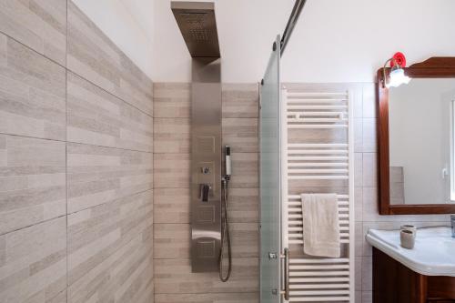 a bathroom with a shower and a sink at Villa Corbezzolo in Galatone