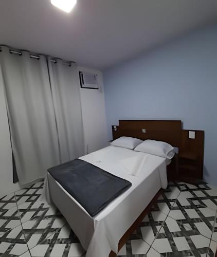 a bedroom with a large white bed in a room at Casa Céu e Mar | Private Seaside Retreat with Breakfast Included in Angra dos Reis