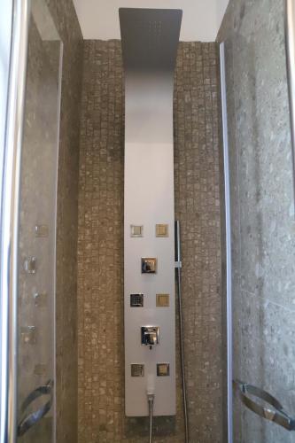 a bathroom with a walk in shower and a mirror at Domus Marina - Ionio room in Mondragone