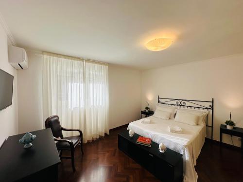 Postel nebo postele na pokoji v ubytování CORTILET