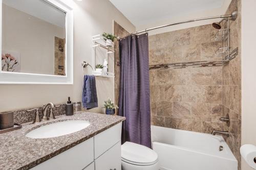 a bathroom with a sink and a toilet at Entire Home in Lanham MD in Lanham
