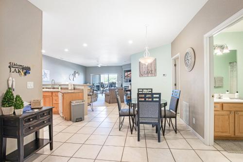 a kitchen and dining room with a table and chairs at Experience Lakeside Living at Its Finest: Stunning Views and Prime Location! in Laguna Beach