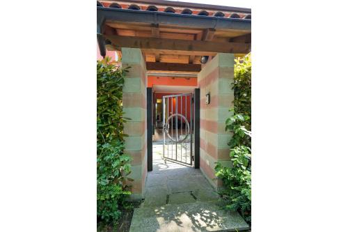 an entrance to a building with a gate at Villetta dei Pascoli in Baveno