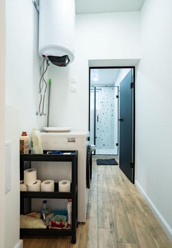 a bathroom with a sink and a mirror at Cozy in Varna in Varna City