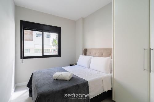 Ένα ή περισσότερα κρεβάτια σε δωμάτιο στο Apto 2 Quartos a 300 m da Beira-mar Norte EVP0214