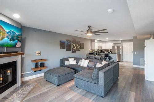a living room with a couch and a fireplace at Lakeview Condo w/ 2 Pools & Beach - Family Fun Awaits at 21MM in Laguna Beach