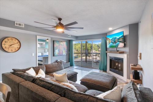 a living room with a couch and a fireplace at Lakeview Condo w/ 2 Pools & Beach - Family Fun Awaits at 21MM in Laguna Beach
