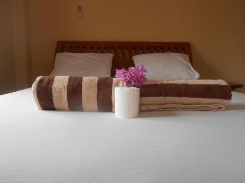 En eller flere senge i et værelse på Pondok Sunrise 2