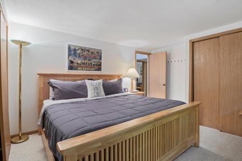 a bedroom with a large bed in a room at Spacious, Quiet & Great Cove, Nearby Attractions, Private Dock, Fireplace, Expansive Deck in Rocky Mount