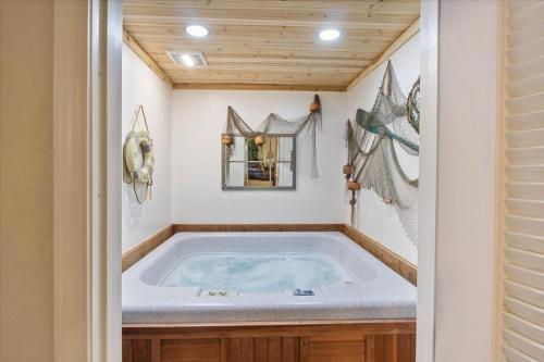 a jacuzzi tub in the corner of a house at Six Suites with Hot Tubs, Private Jacuzzi Baths, Wooded Garden and Lake Access with Boat Slip in Damsel