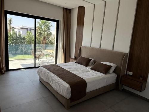 Postel nebo postele na pokoji v ubytování Villa Ayline