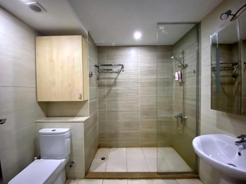 a bathroom with a shower and a toilet and a sink at G-Cribs, El Gouna in El Gouna