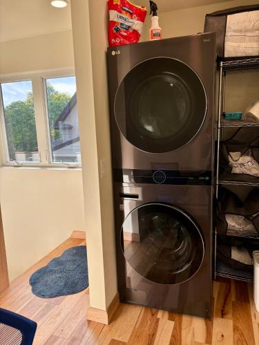 a washer and dryer in a room at Stunning city views guesthouse in Saint Paul