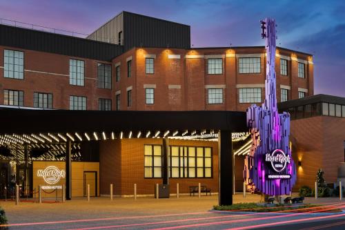 a building with a guitar sculpture in front of it at Hard Rock Hotel London Ontario in London
