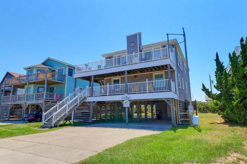 a large house with stairs leading up to it at 5070 - Sandy Bottoms in Croatan Shores