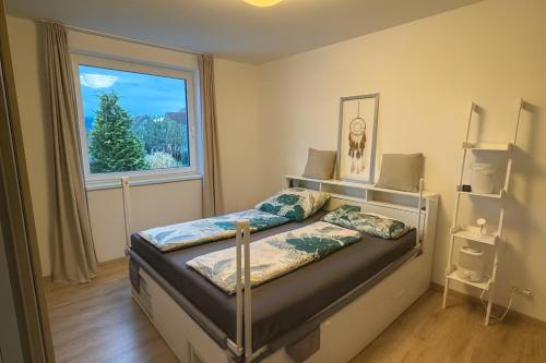 a bedroom with a bed with a large window at Modern House in Spielberg near Red Bull Ring in Spielberg