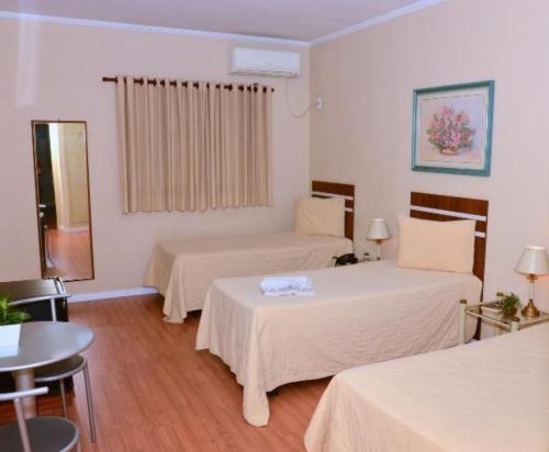 Postel nebo postele na pokoji v ubytování Skalla Hotel Nova Odessa