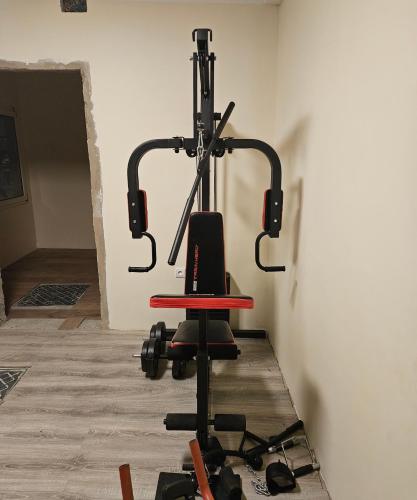 a gym with a chair in a room at Modern and bright light room 
