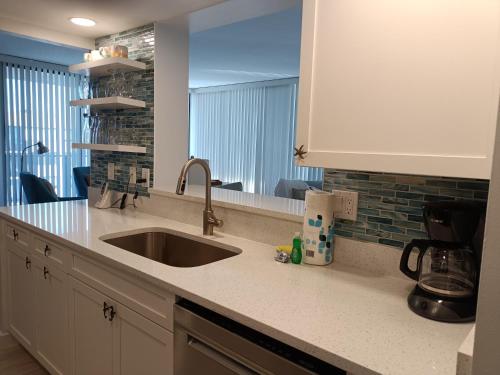 a kitchen counter with a sink and a window at Our House at the Beach W-704 in Siesta Key