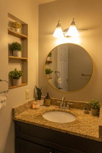a bathroom with a sink and a mirror at Mi Light House 米拉 in Yellowknife