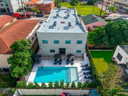 an aerial view of a building with a swimming pool at Prestige Retreat by Renzzi in Miami