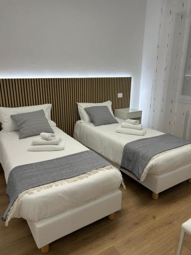 Ένα ή περισσότερα κρεβάτια σε δωμάτιο στο Sweet Family 1