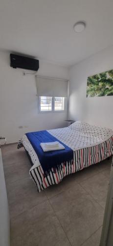 En eller flere senge i et værelse på Allegro Suites