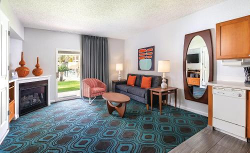 a living room with a couch and a fireplace at WorldMark Palm Springs in Palm Springs
