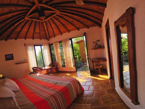 Postel nebo postele na pokoji v ubytování Cabañas el Nido de la Huilota