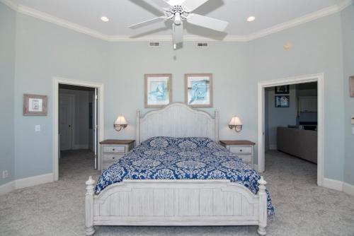 a bedroom with a bed and a ceiling fan at Moonrise Point in Edisto Island