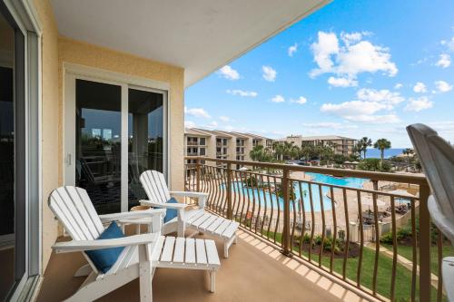 a balcony with chairs and a view of the ocean at HP 325 Sandy Bottoms by 30A Escapes in Rosemary Beach