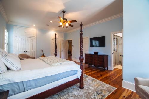 a bedroom with a bed and a ceiling fan at Misty Lane in Edisto Island