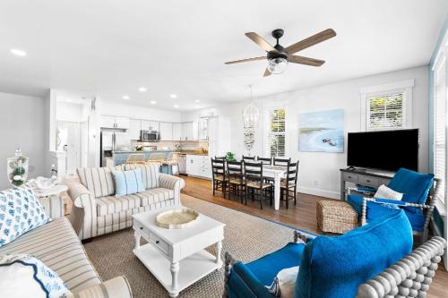 a living room with couches and a dining room at Hidden Gem #6 by 30A Escapes in Seacrest