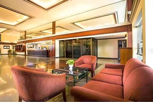 a living room with a couch and a table at Sukhumvit soi 4 Apartment Center of BKK in Bangkok