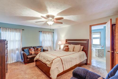 a bedroom with a bed and a ceiling fan at Work and Relax! Spacious Ontario Home with Pool in Mansfield