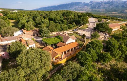 an aerial view of a house with trees and a road at 2 Bedroom Cozy Stacaravan In Obrovac in Obrovac