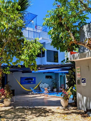 a view of a house with a yellow hose at The Blue Eco Lodge in Valladolid