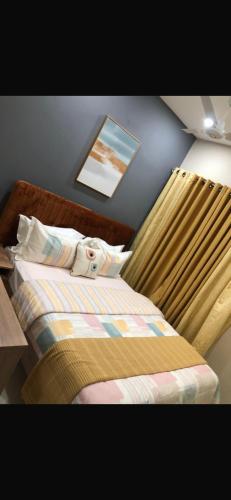 a bedroom with a bed with a towel on it at Aquaview in Bijilo