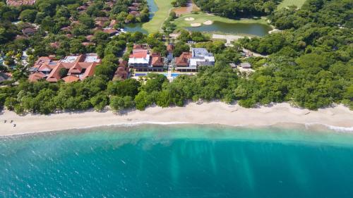 an aerial view of a resort on a beach at A10- Roble Sabana 201 in Playa Conchal