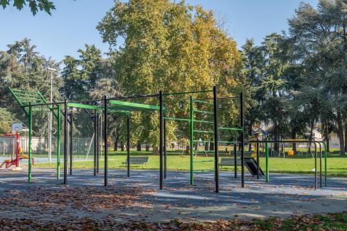 an empty playground in a park at Elegant Urban Home - Free Parking - 7min Niguarda in Bresso
