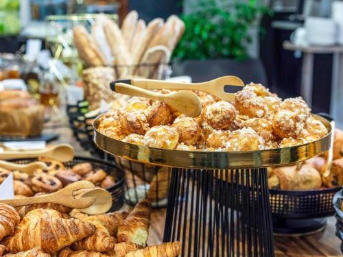 a display of pastries and breads in a bakery at Mercure Bydgoszcz Sepia in Bydgoszcz