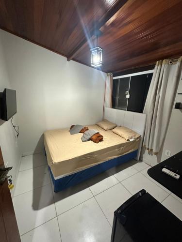 Ένα ή περισσότερα κρεβάτια σε δωμάτιο στο Hospedagem do Centro